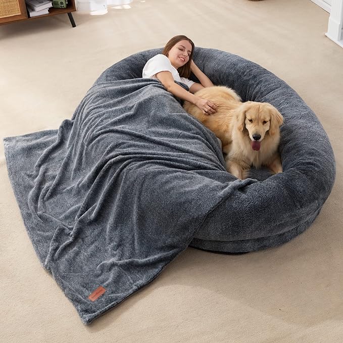 【Enlarged Size and Rich Filler】:This large human dog bed is borrowed from the idea of ordinary dog beds, aiming to create a more cozy space for people themselves. The overall size is as large as 72"x48"x10",which even fits more than 1 adult to lie down. The rim and bottom are filled with high-resilience sponge, which is fluffy and thick to lean on.
【Luxury Warm Fur】:The human-sized dog bed is made of luxurious faux fur with premium fibers. It is thick and warm enough to give a great skin feeling, which is reminiscent of mum's hug. The ultra soft surface of this large dog bed is ideal for men or pets to resist the cold. It aslo pairs with a furry blanket, ensuring you a ultimate comfort for a good rest.
【Ergonomic Support】:The whole design of human dog bed meets the ergonomics concept. The raised rim around provides a sense of security and also excellent support for neck and head. The thicken waved bottom foam prevents people from lying close to the ground and has a strong support for the spine.
【Easy Care】The giant dog bed for humans is easy to set up, only need to remove the vacuum packing bag and wait for its expansion. Please pat and shake it to be completely fluffy before use. The cushion bed has a non-slip PVC dot fabric bottom, making it easily fixed to any floors. The zippered fur cover is also removable and machine-washable.
【Wide-range in Application】Our human-used dog bed with versatile design can be added to the decration of any different room. It could be used as a napping bed or sleeping mat, not only warm but also relaxing. The side carrying handle allows you to take it everywhere you need, to a bedroom, living room or even in office.