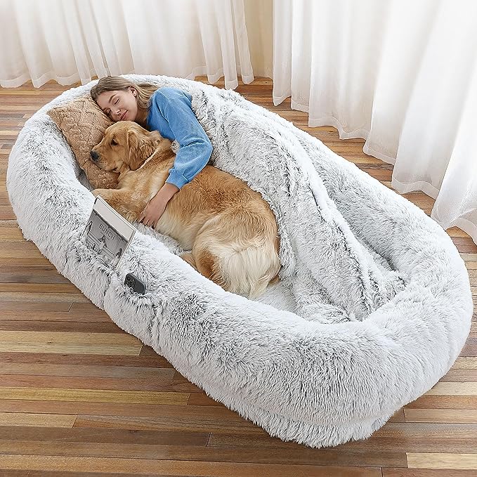 Excellent New Relax & Napping: WROS Human dog bed can provide a new way to enjoy better rest and napping; human dog bed can even accommodate you and your pet to rest and play in it at the same time
Moms Embracing-like Sense of Security: 71*45*12 IN Dog beds for large dogs provide oversized surround; the thick bolster allows you to tuck your hands and feet into it, just like lying in the arms of mom, warm, peace of mind; effectively relieve your anxiety
Comfortable & Convenient: Human dog bed uses premium faux fur plush as the bed cover fabric, which is soft, warm, breathable, and durable; in addition, we have added a storage pocket on the side so that you can put some small items when you lie down inside; we have also presented a strap, so that you can easy storage the extra large dog bed
What Will You Get: The dog bed for human bottom is added with non-slip rubber particles, which are not easy to slide during use; our packaging includes: 1xHuman Dog Bed, 1xSoft Blanket, 1xPlump Pillow, and 1xDurable Strap
Wash & Care: Human dog bed for peoples size just needs to open the zipper, take out the filler, and put the bed cover into the washing machine for low-temperature cleaning; please avoid using high-temperature cleaning or drying, we recommend natural air drying it; if there are any questions, please contact us as soon as possible, and we will solve the problem the first time