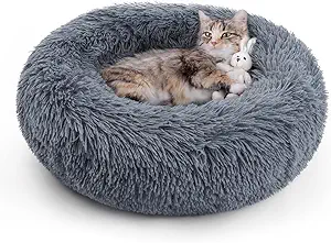 Design for Cozy Sleep: Rabbitgoo donut cat bed features round shape with raised rim which creates a sense of security and support head as well as neck, which allows your cat to curl up and find the most comfortable sleeping position, while internal cotton filling can relieve stress, help your cat calm down faster and get a restful sleep
Ultra Soft Cat Bed: This fluffy cat bed is made of polyester plush fabric, plump and skin-friendly, ensuring your furry friend surrounded by warm hug, ideal for air-conditioned room; Paired with premium pp cotton filling, the bed’s elasticity and overall comfort are increased, your cat will be free to step on and lie down and fall in love with it
Ideal Cat Bed for Indoor Cats: This round pet bed features a rubber base which prevents sliding, so your pet won't accidentally slip when getting on/off of the bed, the bottom keeps the bed in place for worry-free placement on tile or hardwood floors in the home, and the luxury bed with stylish colour will complement your home’s decor and be your pet's indoor companion
Wide Range of Use: This lightweight and portable pet bed is 20 x 20 x 4.7 inches( 50 x 50 x 12 cm) for small cats or dogs up to 13lbs. It works great not only on your home’s floor, but also on the seat of your car, when camping or traveling, it can also creat a cozy nesting spot wherever your companion goes
Washable Cat Bed: We usually recommend hand washing to easy care for the bed. If you choose machine wash, just toss whole bed into the washing machine with cold water in a gentle cycle, and dry the cat bed in the dryer on low heat after washing (Please pat to make the cat bed completely fluffy before use)