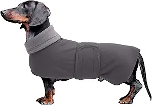 1. Dachshunds Coat: Great quality windproof dachshund sweater can cover the long back, suitable for Dachshunds, Miniature Dachshunds, Sausage, Weiner, Chiweenie even great for other long back low breeds.
2. Sausage dog coat: It's thick, durable, lightweight, and warm. Our puppy coat will be the best choice for your pet wardrobe. A coat to keep your dog warm in autumn or winter weather. Unique gift to unique friend!
3. Wiener Dog Sweater : Reflective piping around the coat, safe in the night. Fold the neck down or keep it up to keep their ears even head warm when you have a walk with your baby in winter.
4. Harness Hole: Contains a small opening on the upper back of the jacket for harness users.
5. Machine Washable, Easy to Store: You can treat it as a common coat, just throw it into washing machine when it`s dirty, just store it like any other clothes. Do not bleach. Tumble dry low. Iron on low heat.