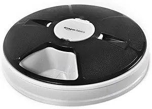 Electronic timed pet feeder for easily controlling feeding times and portions; great when away from home or simply sleeping in
Requires 3 AA batteries, not included; and a small Phillips head screwdriver to reach battery compartment
6 separate food cells for filling with pre-measured amounts of dry or semi-moist cat or dog food
Selectable feeding times up to 24 hours; turns on a timer, giving pets access to each meal, right on time
Removable top cover for easy filling or cleaning; made of durable plastic in a black/grey color combo
Measures 12 by 12 by 2.3 inches; backed by an Amazon Basics 1-year limited warranty