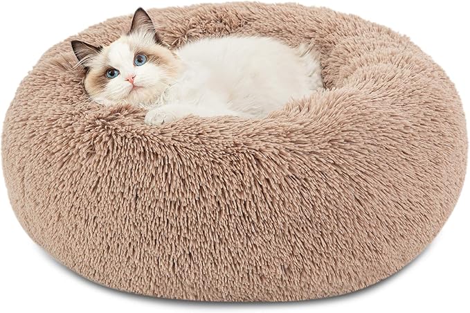 Calming & Comfortable: Our calming dog bed is 20% more plush than most competitors, making it softer and comfier. Its high-quality, calming, and warm faux shag fur creates a safe place for your pet to rest and relax.
Soothing Support: This donut dog bed is ideal for pets who love to curl up. The raised rim snuggles your cat or dog, offering optimal head and neck support and a sense of security. Premium ultra-soft filling offers joint and muscle pain relief.
Pet-Safe: This standard 100 by OEKO-TEX certified dog bed creates a safe and comfortable space for your pet to relax and rejuvenate.
Cozy For All Pets: Our XS size bed is 20"x20" and comfortably fits dogs up to 15 lbs. If you're unsure about size, choose one size up for extra comfort. The non-slip bottom keeps the round dog bed secure for easy access in and out.
Versatile & Easy Care: The minimalist design of this fluffy dog bed fits seamlessly into any space. Find your perfect look with a variety of available colors. Sizes XS-M are fully machine washable. Size L-XL features a washable removable cover.