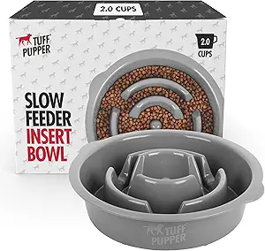 SLOWS DOWN EATING UP TO 10X: (2 Cup Bowl) Our fun and interactive Slow Feeder Bowl is built with uniquely designed wave patterns that separate a full bowl of food into smaller sections that challenge your dog and require more effort to access and eat.
AIDS IN PROPER DIGESTION: Fast-eating dogs often suffer from bloating, vomiting, choking and indigestion. Our Slow Feeder Insert Bowl mentally stimulates your dog during mealtime while helping reduce overeating behavior.
DOGS LOVE OUR INTERACTIVE DESIGN: Our puzzle dog food bowls are guaranteed to slow down fast eating pets of all breeds and sizes. Watch as the groove patterns challenge dogs to eat slower as they work to find food in all the "nooks and crannies".
WORKS AS A STAND ALONE BOWL: With many non-skid rubber pads attached to the bottom, our slow feeding bowl remains securely in place while your dog eats so you can fully replace your existing mealtime dog bowl with your new slow feeder bowl.
INSERT INTO ELEVATED FEEDING TRAYS: You can replace one of the standard bowls in your dog's feeding tray with our Slow Feeder Insert Bowl. Our bowls are designed to fit into most standard size elevated feeding trays. Check your tray hole diameter before you purchase.
ADD TO EXISTING METAL DOG BOWLS: By combining our Slow Feeder Insert Bowl with a standard dog bowl you get the best of both worlds - a heavier bowl that won't flip or slip (not included) plus our slow feeding puzzle bowl to slow down your fast eating puppy.
FITS PERFECTLY IN TUFF PUPPER BOWLS: This 2 cup Slow Feeder Bowl was designed to fit perfectly into our 66oz SuperBigSlurp insulated metal dog bowl (sold separately). Combine them both for the perfect non-slip, non-flip weighted slow feeder bowl for the messiest, aggressively eating dogs.