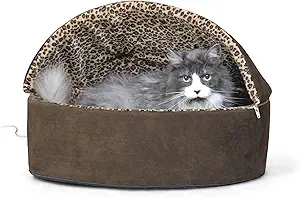 HEATED CAT BED: Features a removable hood for the ultimate private heated kitty cave and 6-inch tall soft foam walls for your cat's comfort and security
OPTIMAL TERMPERATURE: Electric heated cat bed is thermostatically controlled to automatically warm to your cat's normal body temperature only when your kitty is in the heated pet bed
ENERGY EFFICIENT: Heated cat bed is low wattage and extremely energy efficient; the thermostatically controlled 4 watt heater is removable for use in all seasons
MACHINE WASHABLE: K&H Thermo-Kitty heated cat bed features a removable cover for easy wash and care
SAFETY: K&H doesn't just use safety listed parts, we safety certify the entire product. This heated cat bed has been tested & certified by MET Labs and exceeds USA/CA electrical safety standards
BRAND YOU TRUST: Designed by K&H with OVER 20 years of experience in creating safe, innovative, quality products for pets
SIZING: The K&H Thermo-Kitty Bed with hood is available in two colors and sizes; both sizes come in mocha and tan, the small measures 16" in diameter, and the large measures 20" in diameter